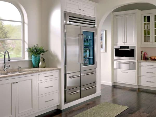 Sub-Zero luxury refrigerator in a bright kitchen Sub-Zero luxury refrigerator in a bright kitchen